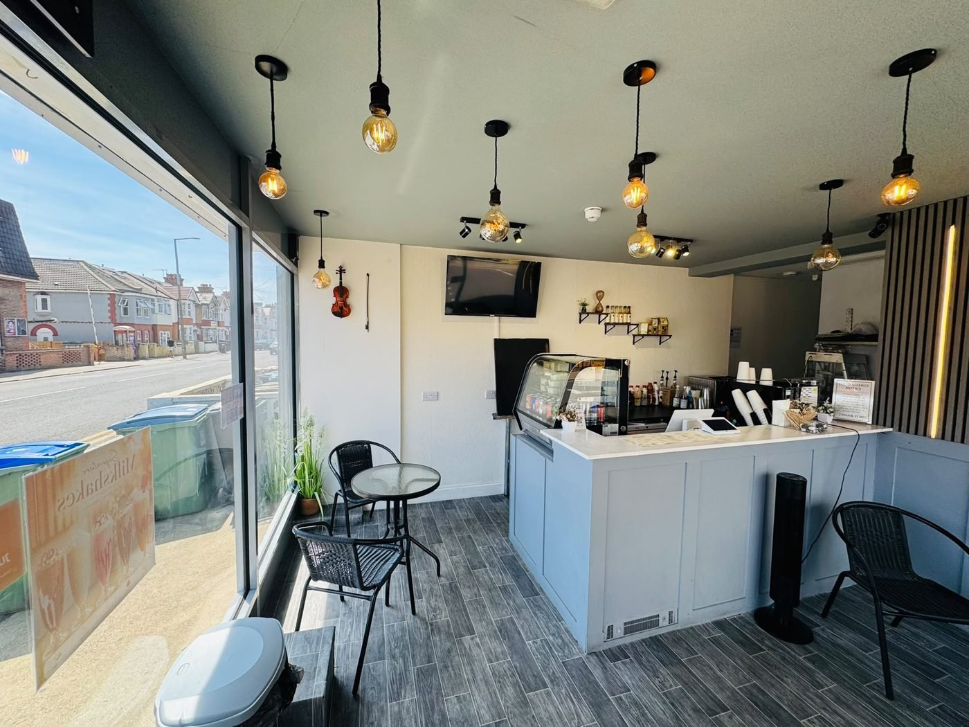 Spuds & Shakes interior — window seating and street view